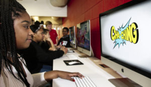 Jackson National associates teach 'Money Matters' to teens at the Boys and Girls Club of Lansing Jackson Teen Zone. [MATTHEW DAE SMITH | for Jackson]